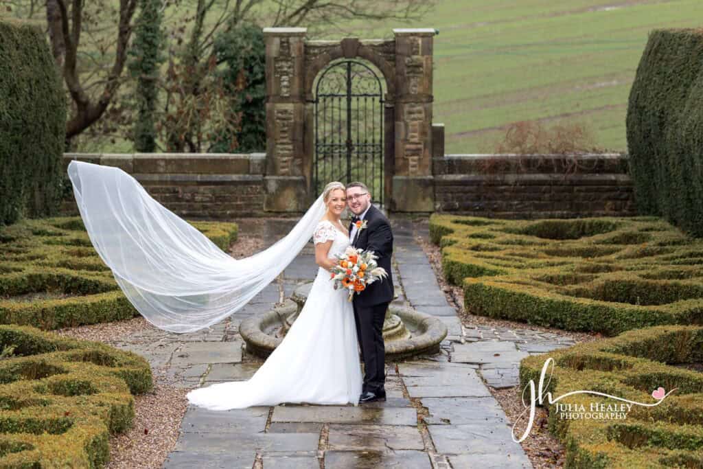 Bride and groom in garden wedding photo